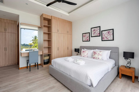 Bright master bedroom with garden views and modern decor at Villa Ombra, Koh Samui Thailand