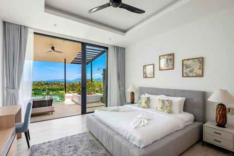 King bedroom with private balcony and stunning sea views at this Mae Nam holiday villa