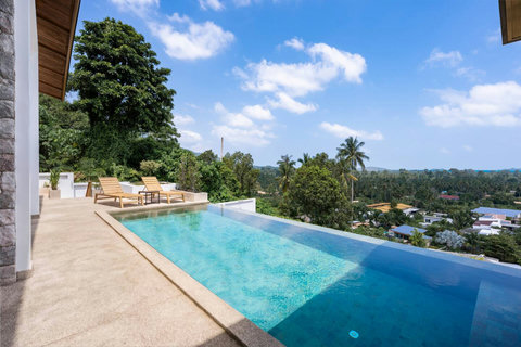 Villa Ombra pool illuminated at dusk with stunning evening ambiance in Mae Nam, Koh Samui