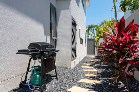 Fire up your own meals on the private gas grill tucked in a quiet corner of the garden, surrounded by tropical plants.
