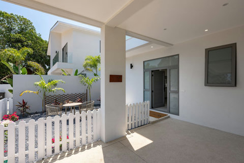 Settle into this shaded terrace to watch the day unfold, with breezes and garden views surrounding you.