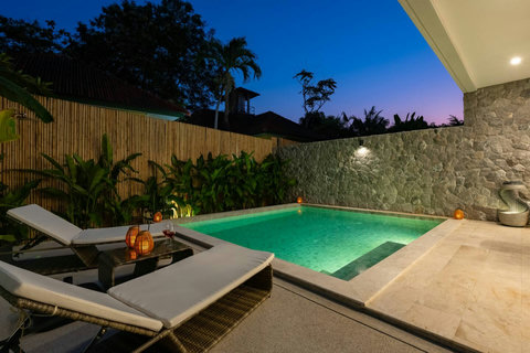 Your own glowing oasis under the stars—dive into the illuminated turquoise pool or lounge poolside as evening unfolds in complete privacy and style.