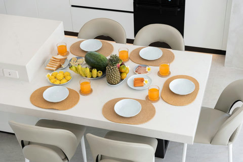 Gather around this bright dining table for fresh tropical fruits and morning juice, ready to start your day together.