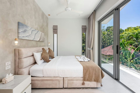 Settle into the plush sofa and unwind. Contemporary art and soft furnishings create a welcoming gathering space.
