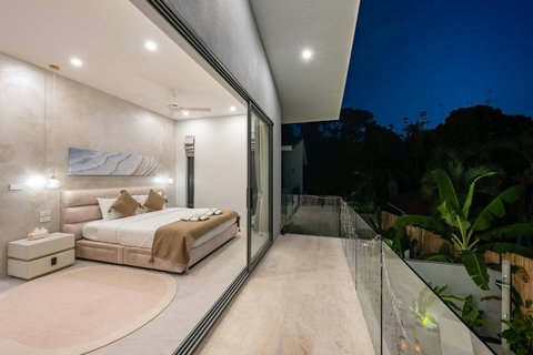 Watch your villa glow warmly as evening settles over the garden, creating a magical atmosphere outside your door.