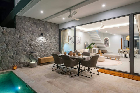 Watch the sun set over your private pool as outdoor lighting creates a magical evening ambiance for dinner and drinks.