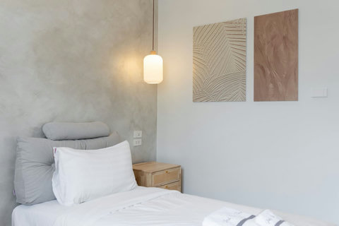 Get ready for your day in this clean, modern bathroom with soft lighting and contemporary touches.