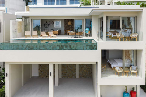 Side view showing pool, dining area and bedroom level beneath