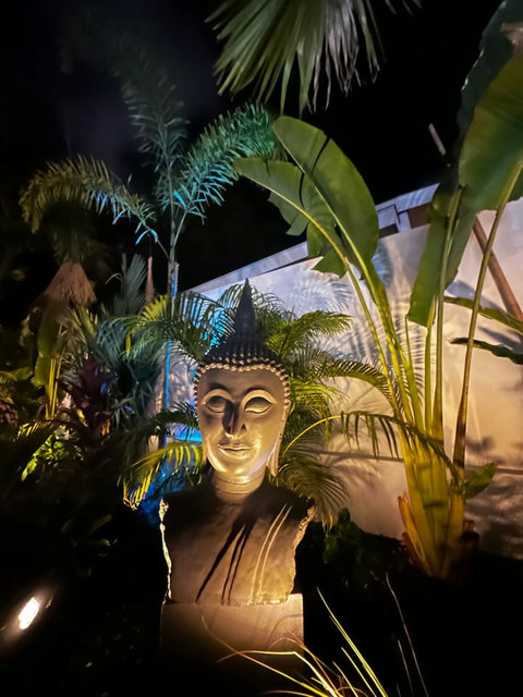 Buddha statue at night in the garden at Villa Amala, Mae Nam Koh Samui pool villa.