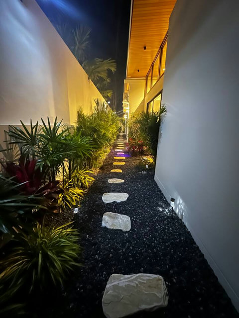 Lit pathway through the garden at Villa Amala by night – 3BR pool villa Mae Nam Koh Samui.
