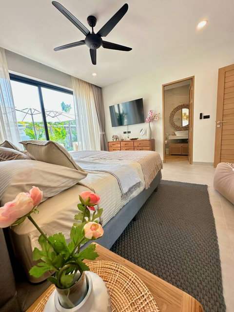 Welcoming bedroom with floral touches at Villa Amala 3BR pool villa Koh Samui.