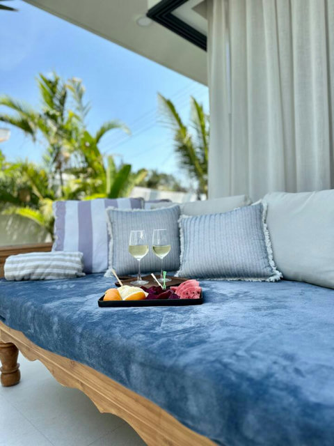 Wine and tropical fruit on a poolside daybed – unwind at Villa Amala 3BR pool villa Koh Samui.