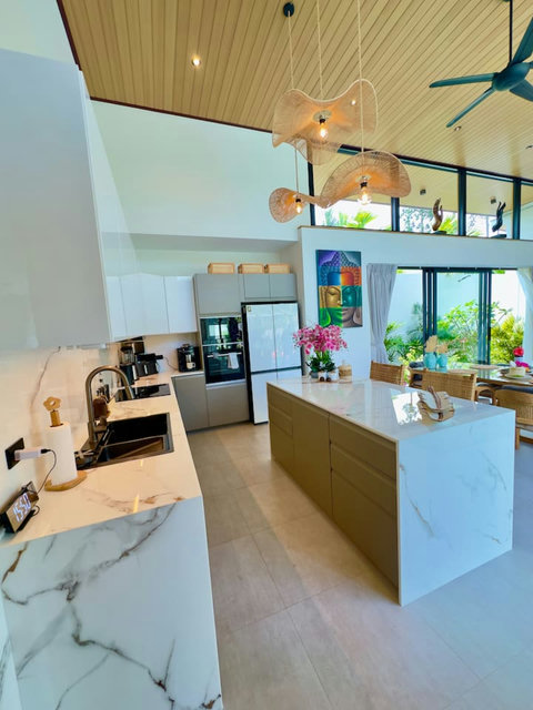 Open kitchen with island, fridge and natural light – Villa Amala 3 bedroom pool villa Koh Samui.