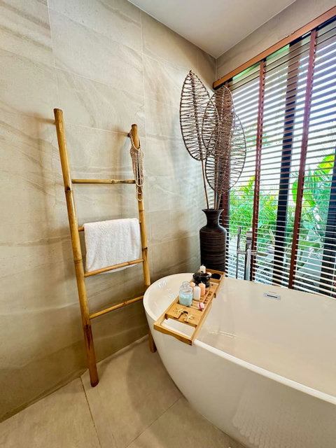 Bathroom with bamboo accents and tropical view at Villa Amala 3BR pool villa Koh Samui.