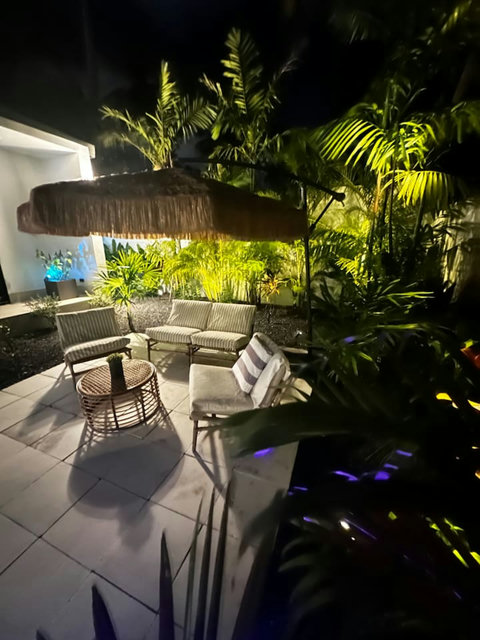 Outdoor lounge area set in the tropical garden at Villa Amala 3BR pool villa Koh Samui.