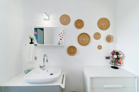 Bathroom N°2 Charming bathroom details featuring stylish minimalist design and elegant wall decorations for a tropical touch