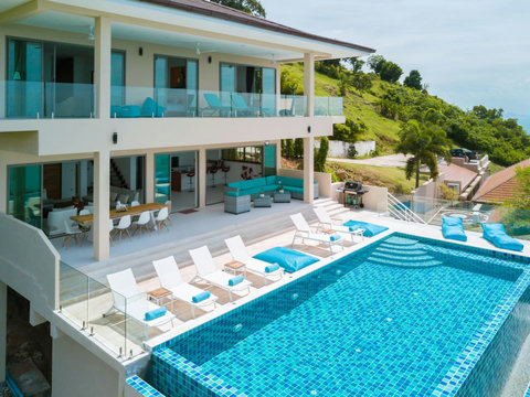 Spacious poolside terrace and outdoor dining area, perfectly designed for alfresco meals and unforgettable gatherings