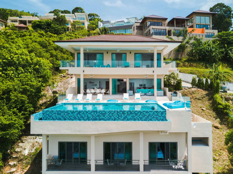 An aerial preview of luxury: A massive, modern 5-bedroom villa perfectly positioned to blend privacy with tropical elegance