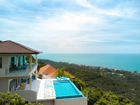 An elevated scenic viewpoint from the villa, capturing the stunning contrast of tropical nature and the calm blue sea