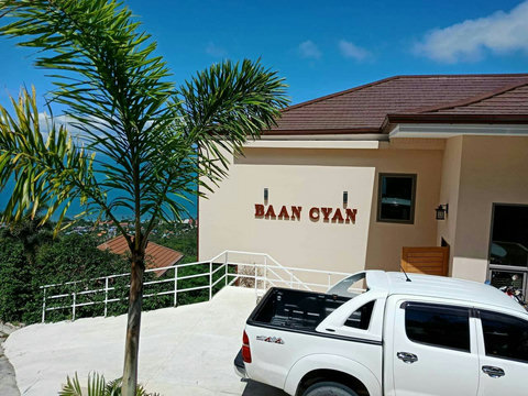 Car Park Secure private parking area welcoming you with the villa's signature 'Baan Cyan' entrance sign.