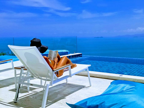 Unwind in absolute luxury with an in-water sun lounger, ideal for diving into a good book right by the pool edge