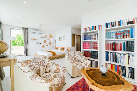 The ultimate relaxation haven: The Master Bedroom complete with a beautiful built-in library, perfect for peaceful nights