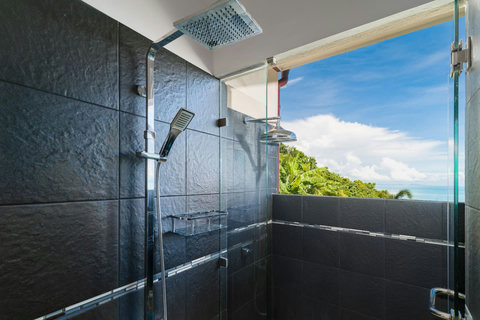 Inside / Outside Shower N°2 A luxurious open-air style shower experience, letting you enjoy a refreshing rinse with views of lush greenery and the ocean