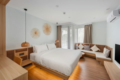 Sink into your cool, quiet bedroom after a day exploring Samui. Air conditioning and a flat-screen TV make it your perfect retreat.