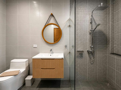 Clean, simple bathroom with a refreshing shower—perfect for rinsing off sand and salt after swimming.