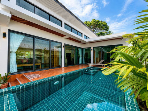 The villa's inviting pool is your own slice of paradise—ideal for morning swims or afternoon cooling off.