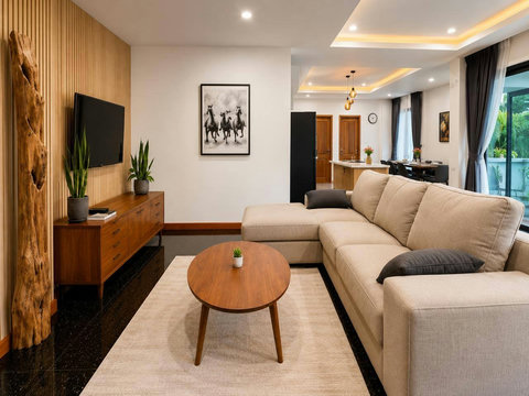 Comfortable living space where you can relax with a cool drink and unwind in the air conditioning after beach days.