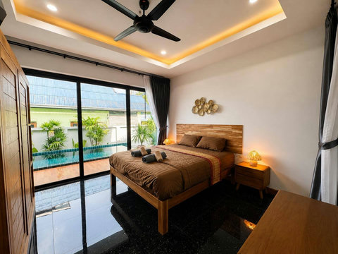 Welcoming second bedroom with a cozy bed and cool air—great for extra guests or kids.