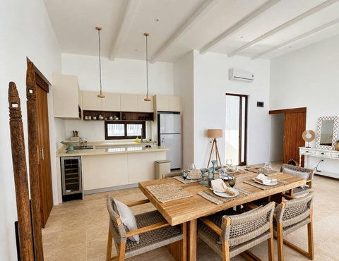 “Cozy indoor dining beside the kitchen in our Koh Samui pool villa”
