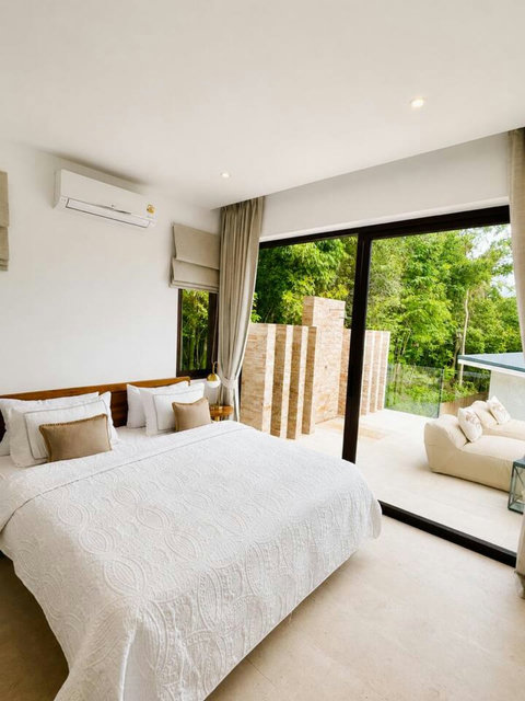 “Bedroom with balcony and seaview at Solaya Seaview Pool Villa Koh Samui”