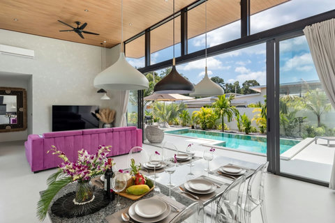 Indoor dining and living area overlooking the private pool