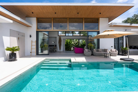 Private pool with entry steps beside the open-plan living area