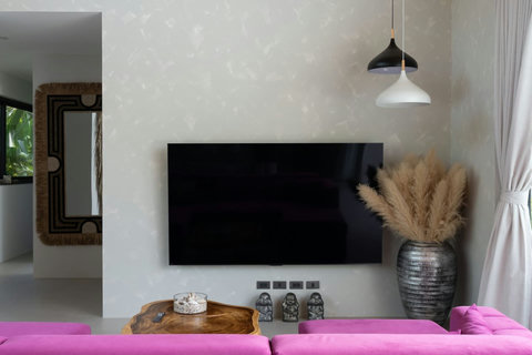 Wall-mounted TV and coffee table in the bright living room