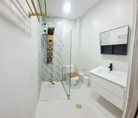 A clean, well-stocked guest bathroom with everything you need for a comfortable stay