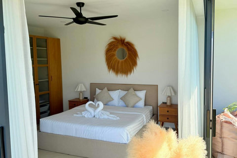 Bright master bedroom with king-size bed at Villa Jo in Bophut, Koh Samui