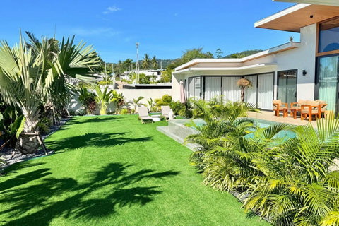 Beautiful landscaped garden and pool area at a tropical villa in Koh Samui