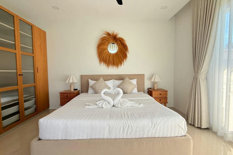 Comfortable tropical bedroom with elegant décor in a private Koh Samui villa