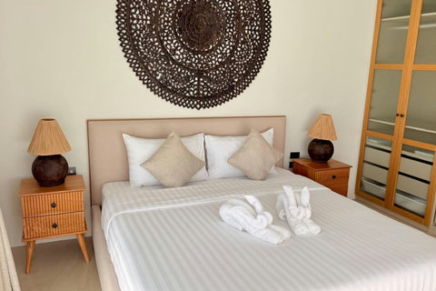 Relaxing private bedroom with luxury bedding in a Bophut holiday villa