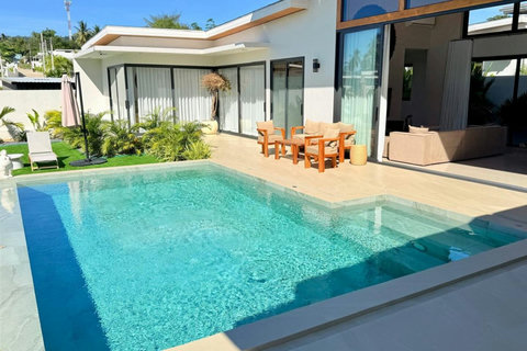 Modern private pool and outdoor dining terrace at a Koh Samui villa rental