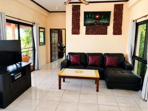 Settle into the serene living room where you can unwind with loved ones or enjoy a quiet afternoon.
