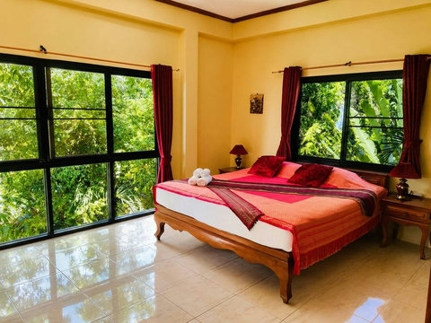 Rest in the peaceful master bedroom where a gentle breeze and the sounds of the garden lull you to sleep.