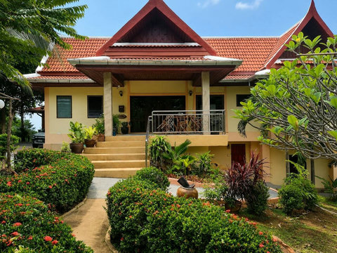 The villa's clean lines and open terraces seem to float above the landscape, offering endless vistas.