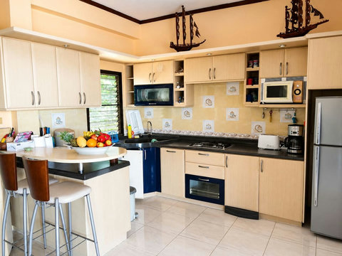 Prepare meals in this well-equipped kitchen, from morning coffee to sunset cooking with ocean views.