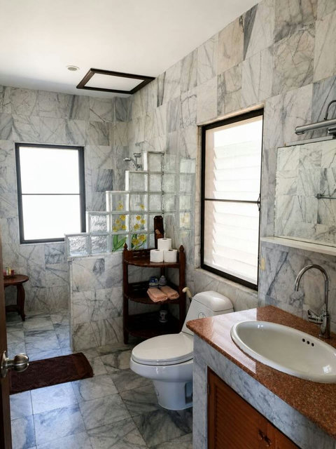 Start and end each day in this bright, clean bathroom with all the essentials for your comfort.