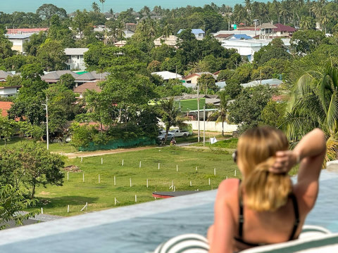 Elevated hillside setting with lush greenery and beautiful panoramic views across Koh Samui.