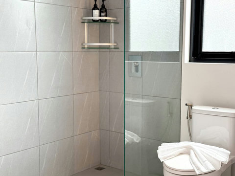 Contemporary bathroom with glass shower, clean finishes, and a bright modern design.